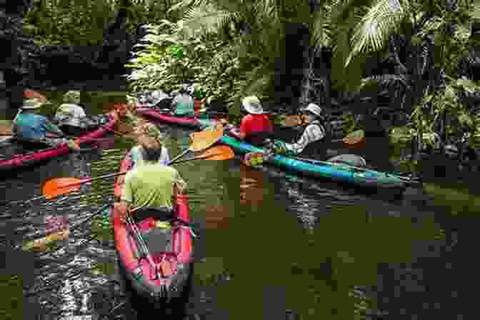Dane Maddock Kayaking Through A Narrow River Surrounded By Lush Vegetation Blue Descent: A Dane Maddock Adventure (Dane Maddock Adventures 1)